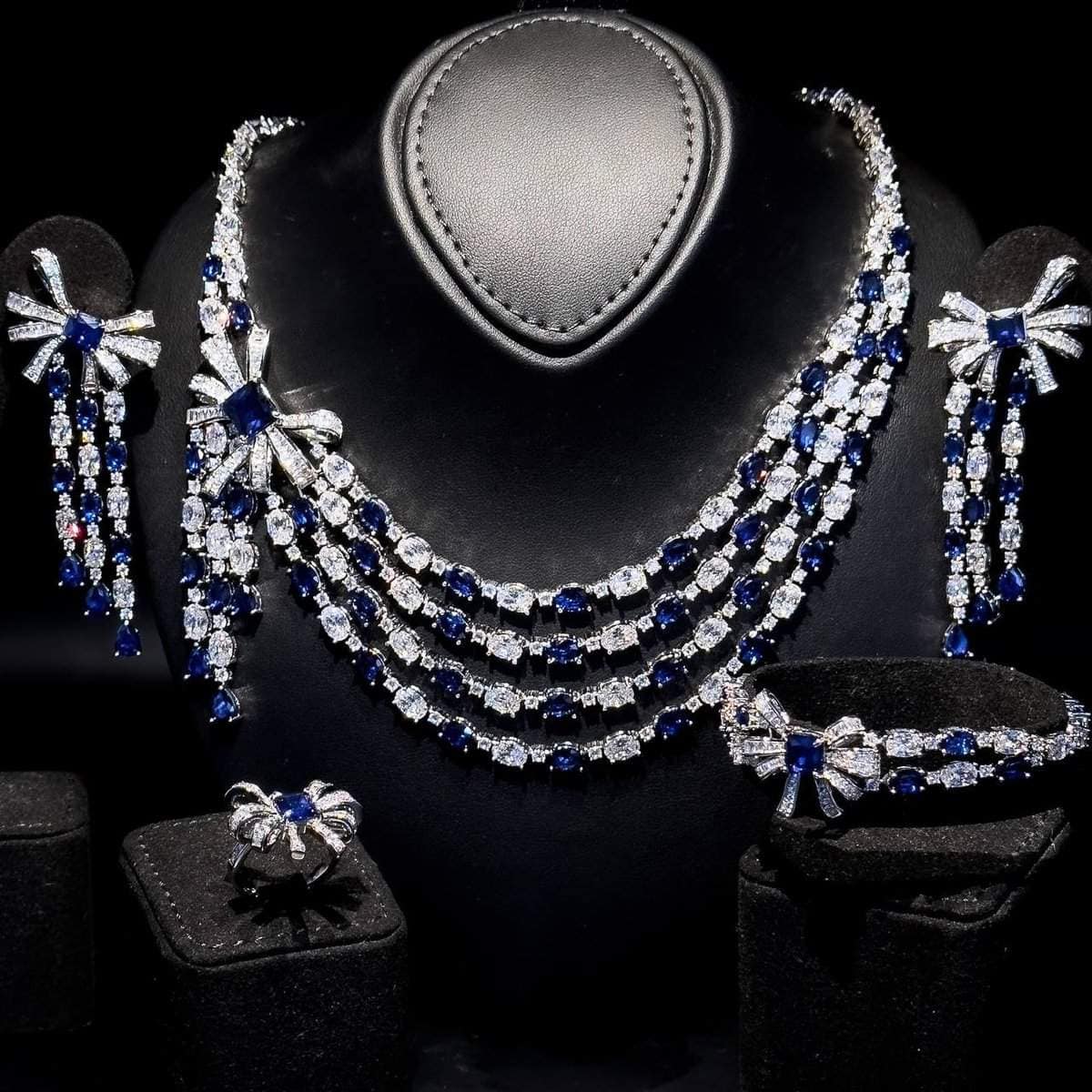 Omnia Mawada Blue Bridal Full Set with Elegant Bow-Accent Design and High-Quality Zircon Stones in Rhodium Plated Finish ( only available in KSA)