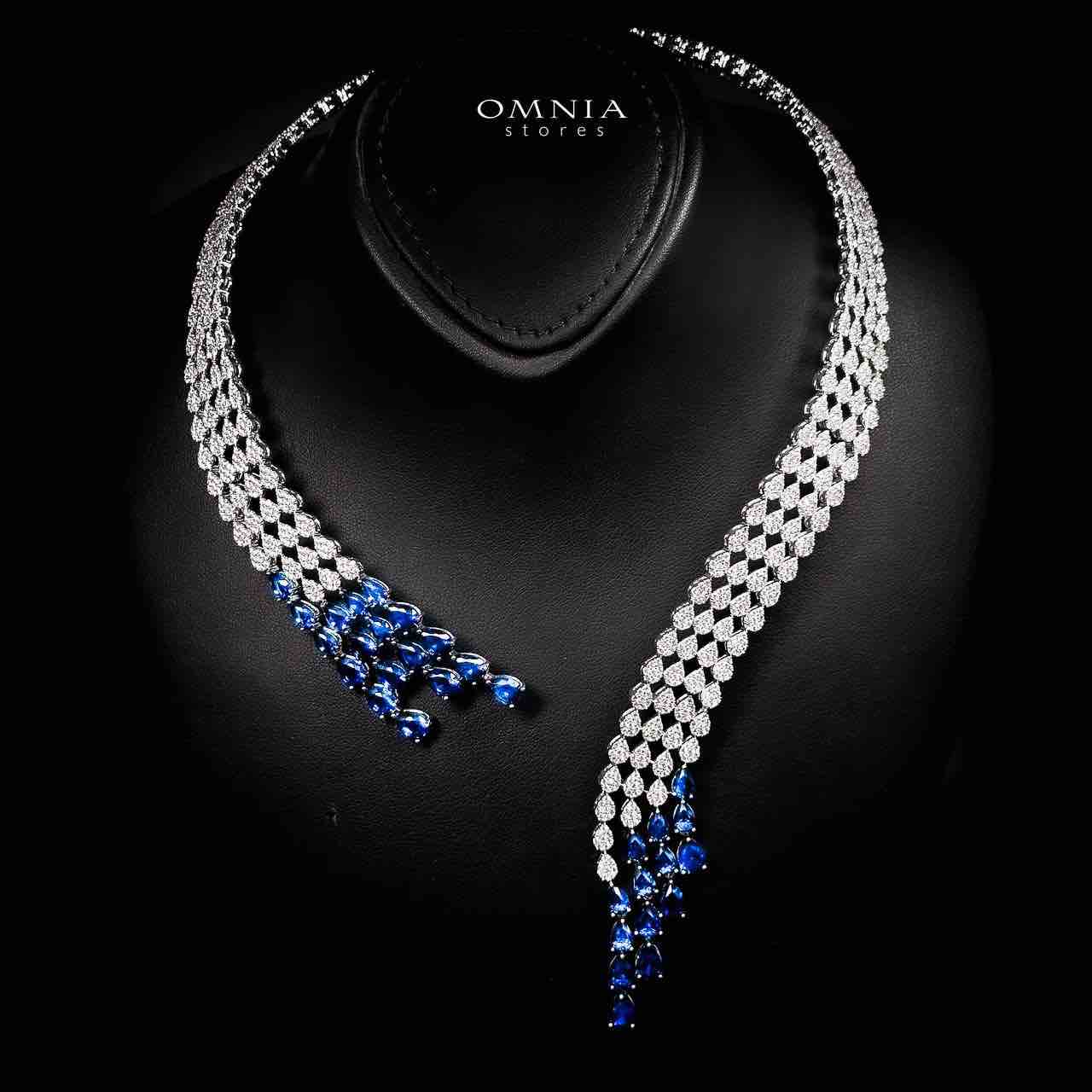 طقم زفاف فاخر من أومنيا أمراه باللون الأزرق، مرصع بأحجار الزركون عالية الجودة ومطلي بالروديوم.