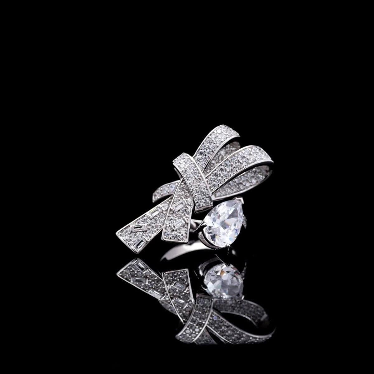 Omnia Celeste Bow Design Ring in 92.5 Silver with High-Quality Simulated Diamonds and a Pear-Shaped Accent - OMNIASTORES KSA