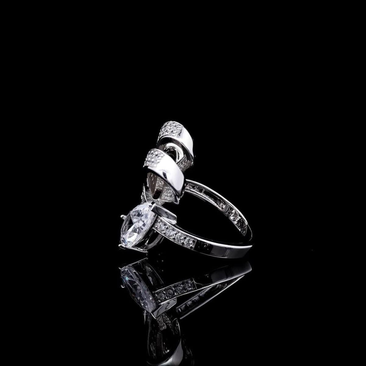 Omnia Celeste Bow Design Ring in 92.5 Silver with High-Quality Simulated Diamonds and a Pear-Shaped Accent - OMNIASTORES KSA