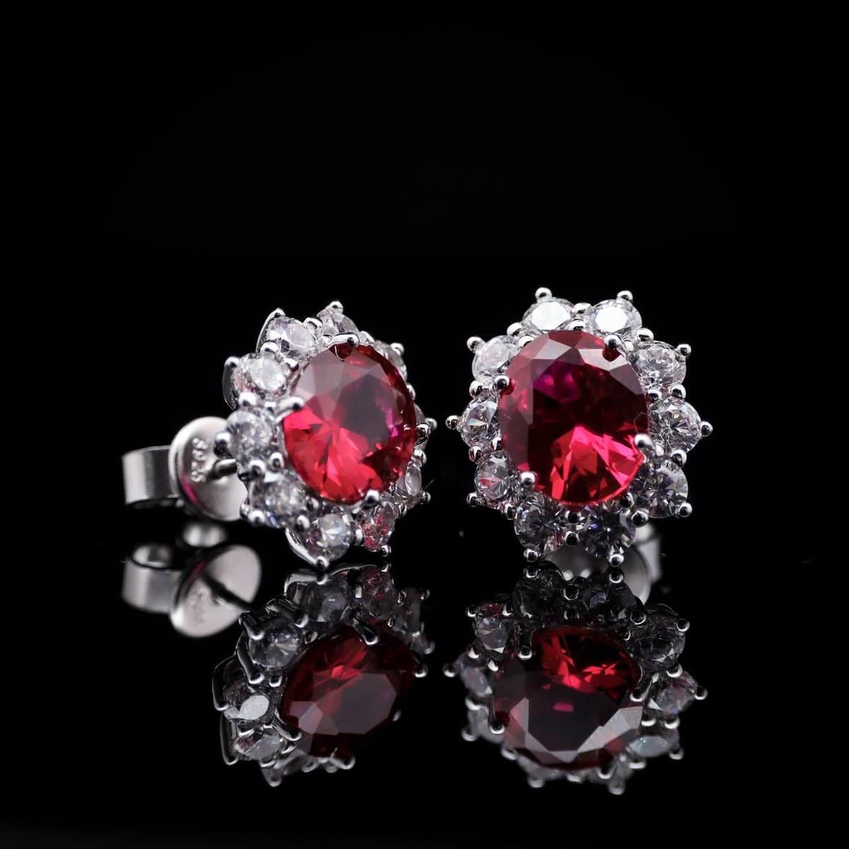 Omnia Elara Ruby Red Oval Stud Earrings in 92.5 Silver with High-Quality Simulated Diamonds - OMNIASTORES UAE