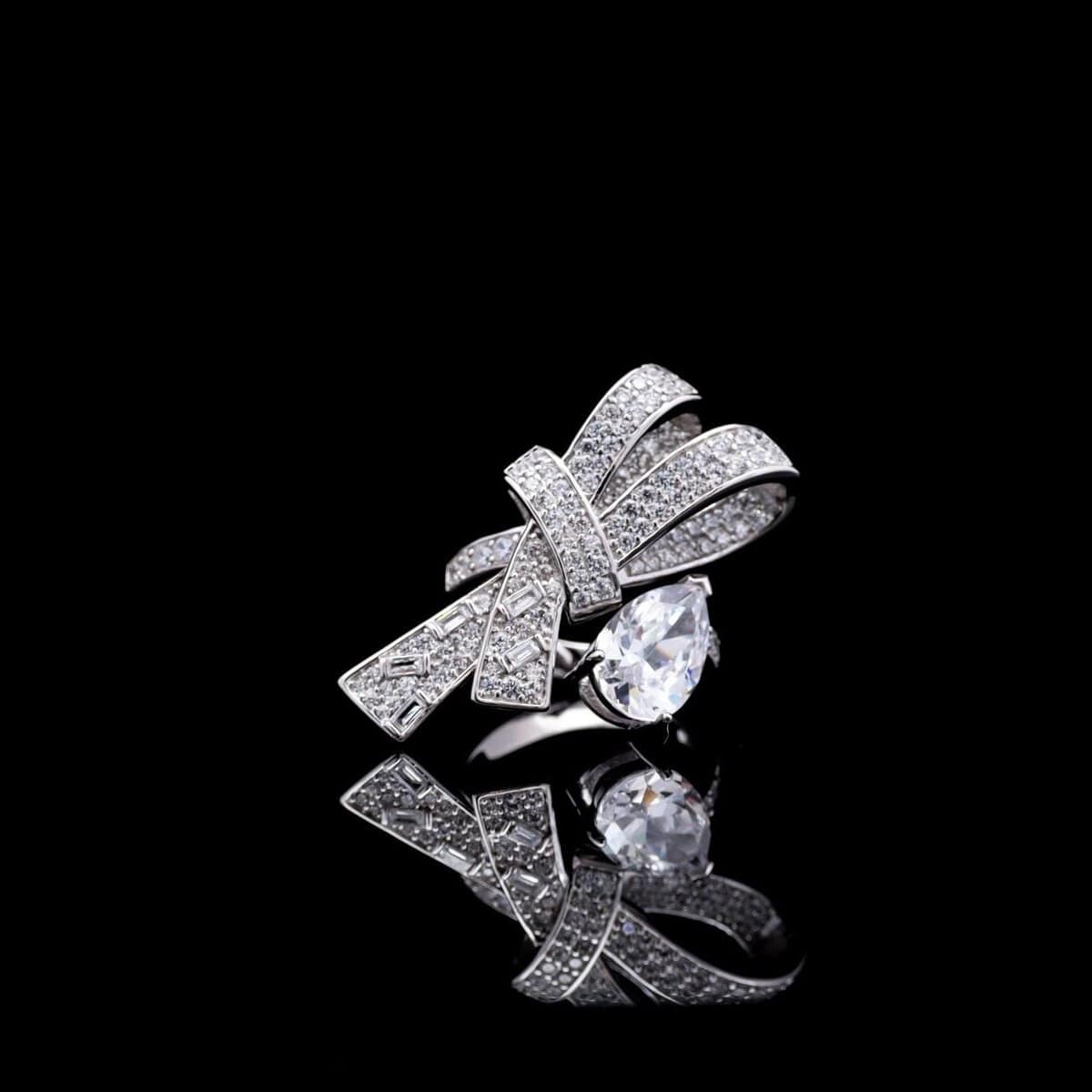 Omnia Celeste Bow Design Ring in 925 Silver with High-Quality Simulated Diamonds and a Pear-Shaped Accent - OMNIASTORES UAE