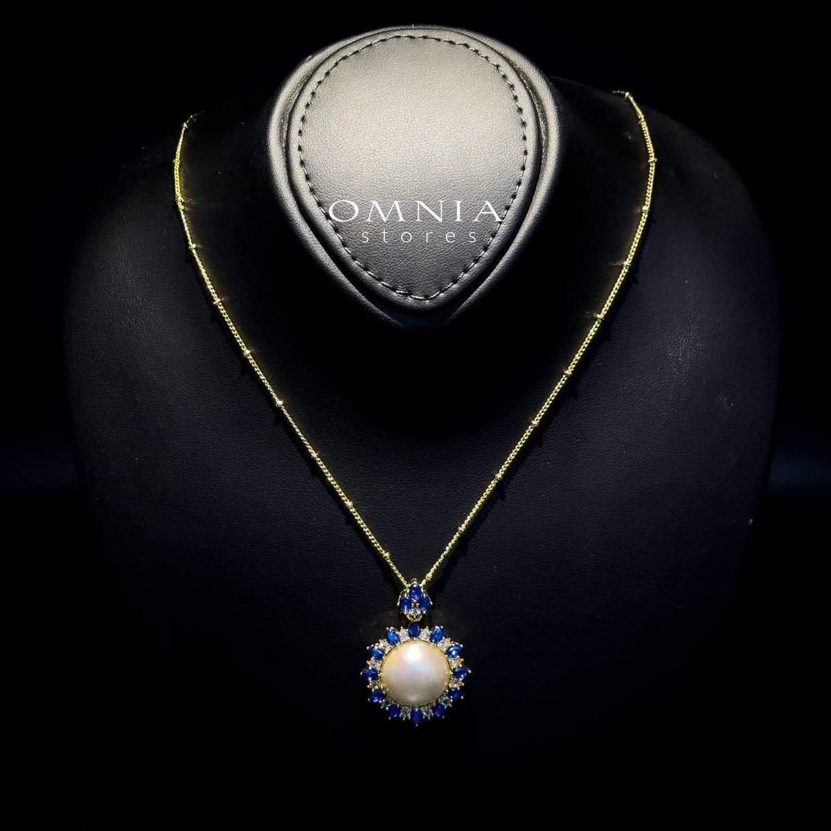 Omnia Celeste White Mabel Pearl Halo Pendant Necklace with Blue Sapphire Accents in Brass with Gold Plated Finish - OMNIASTORES UAE