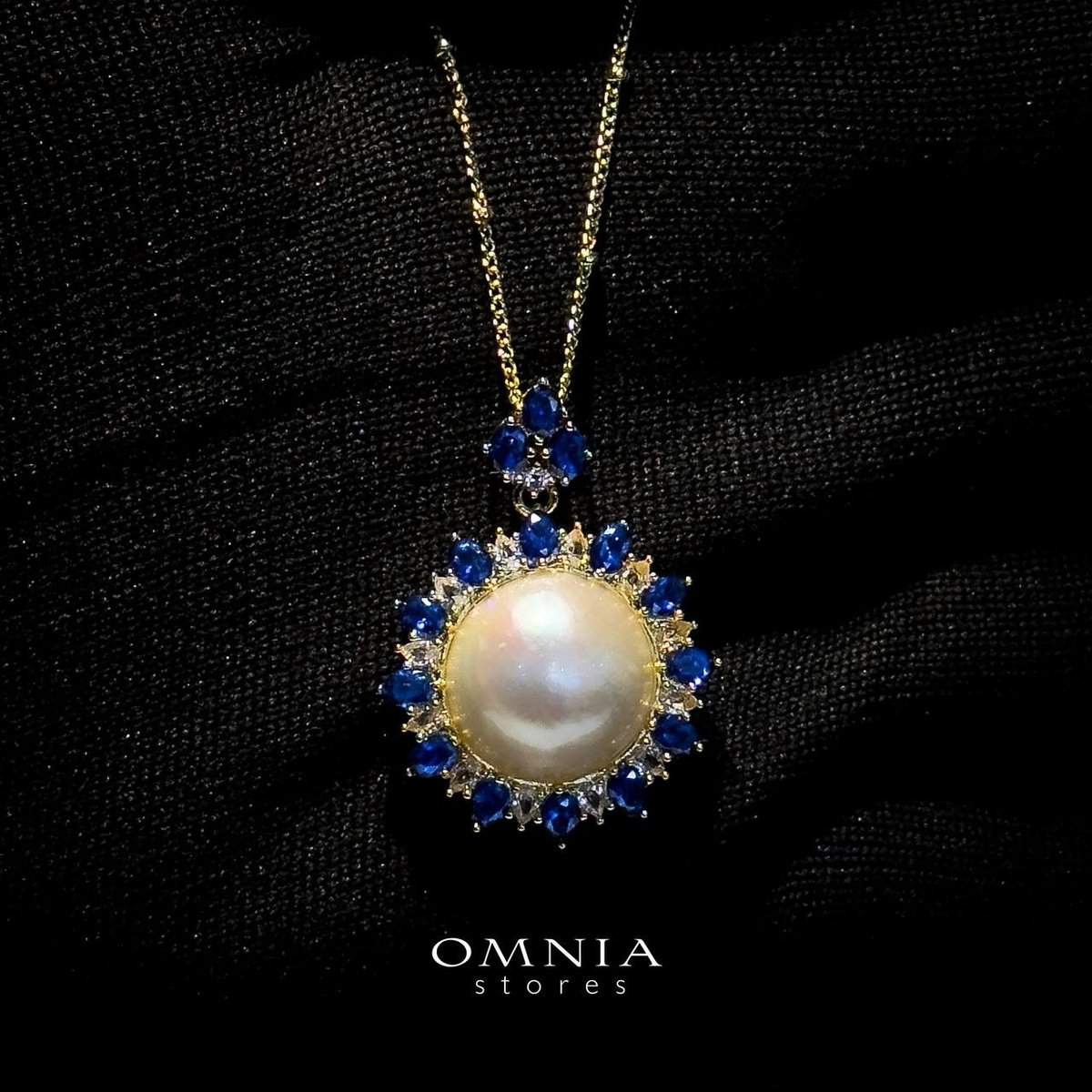 Omnia Celeste White Mabel Pearl Halo Pendant Necklace with Blue Sapphire Accents in Brass with Gold Plated Finish - OMNIASTORES UAE